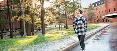 Student walking around the grounds of Bishops