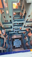 Blick von oben in den geometrisch gestalteten Innenhof eines mehrstöckigen Gebäudes.
