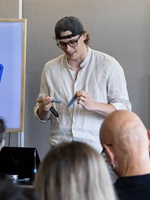 Student explains different oral care devices during a classroom presentation