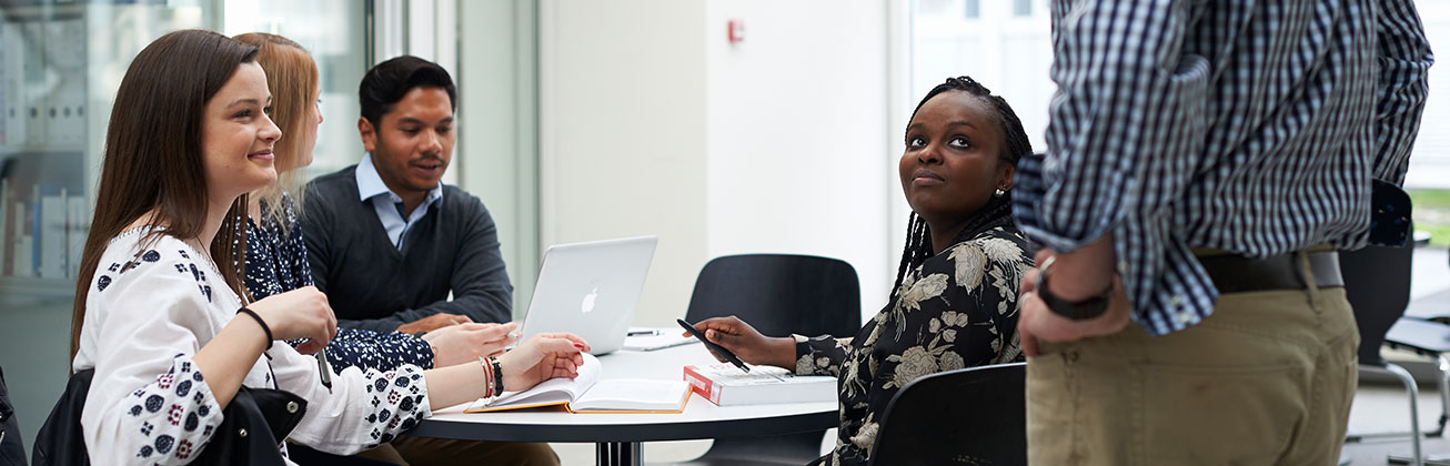 Persons working at a table