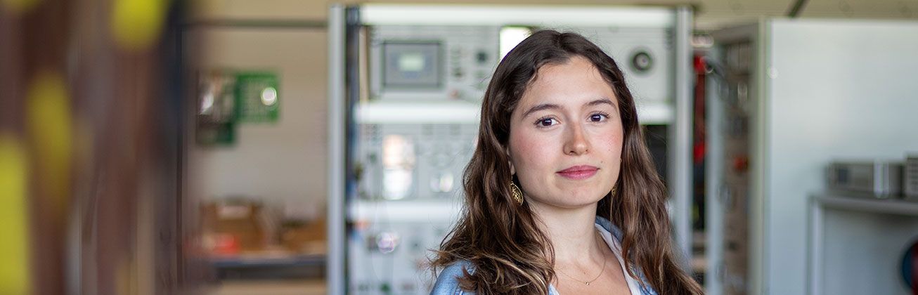 Female student smiling in lab.
