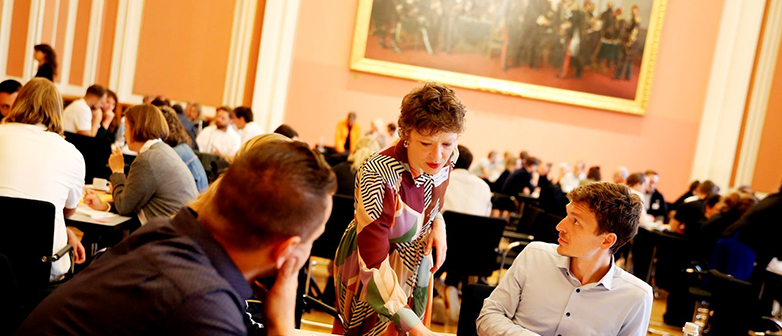 Guest speaker Caroline Paulick-Thiel talks to a workshop participant