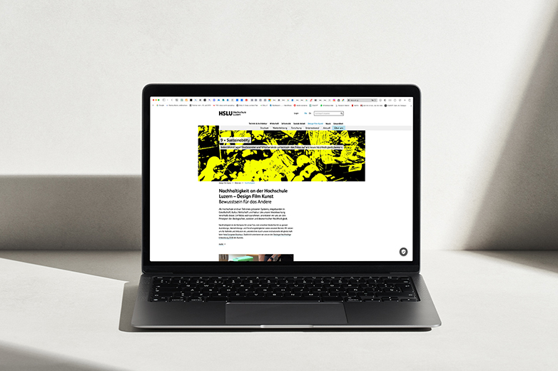 Ein Computer, der die Seite von 9x Sustainability zeigt, im Hintergrund gibt es ein Schattenspiel. 