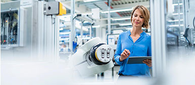 Female researcher checking digital twin in laboratory