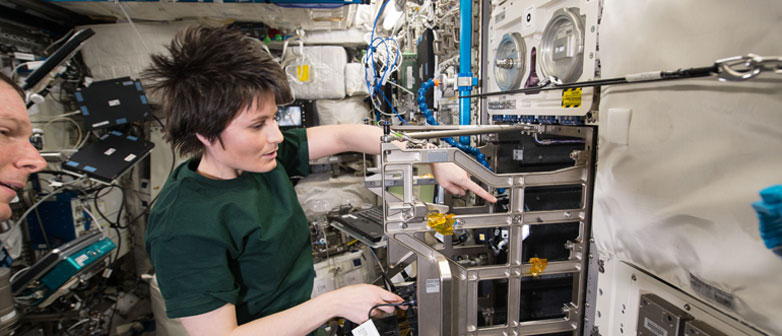 Female astronaut in Columbus module on ISS