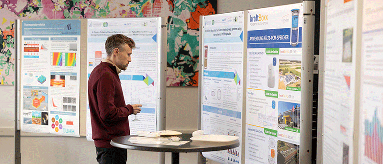 A person watching posters, at the poster session sstes 2026