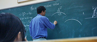 Teacher at black board